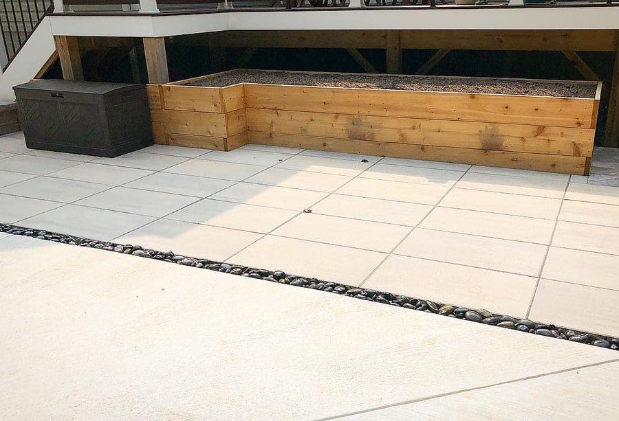 Patio with concrete slabs and pebble border