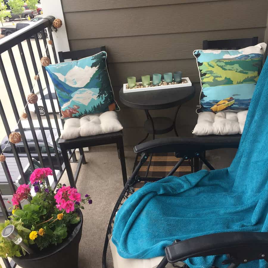 apartment balcony with throw pillows and blankets