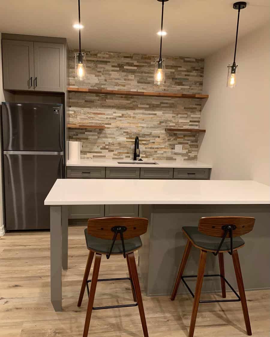 Contemporary basement kitchenette with pendant lighting