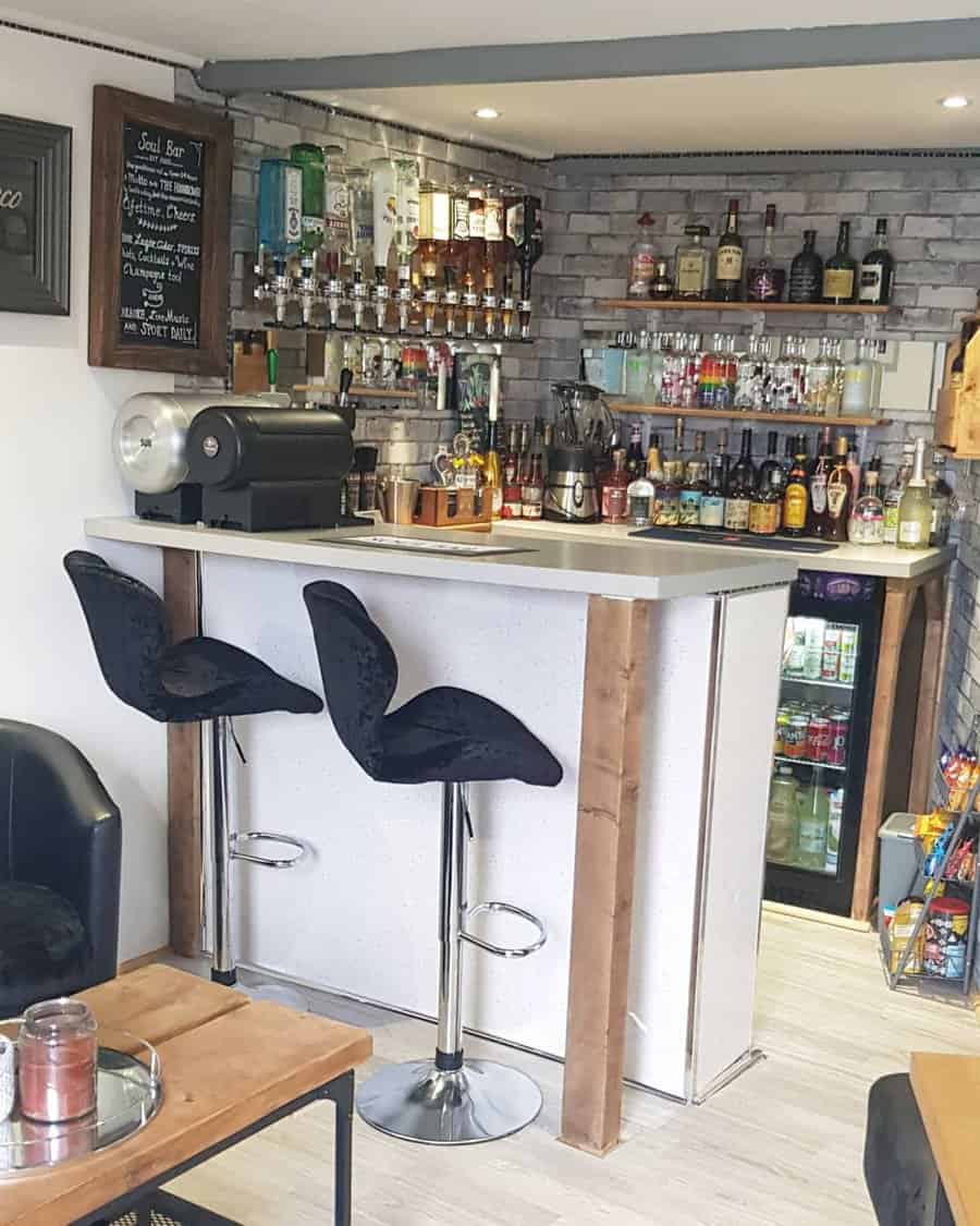 Home bar corner with sleek chairs and brick accent wall