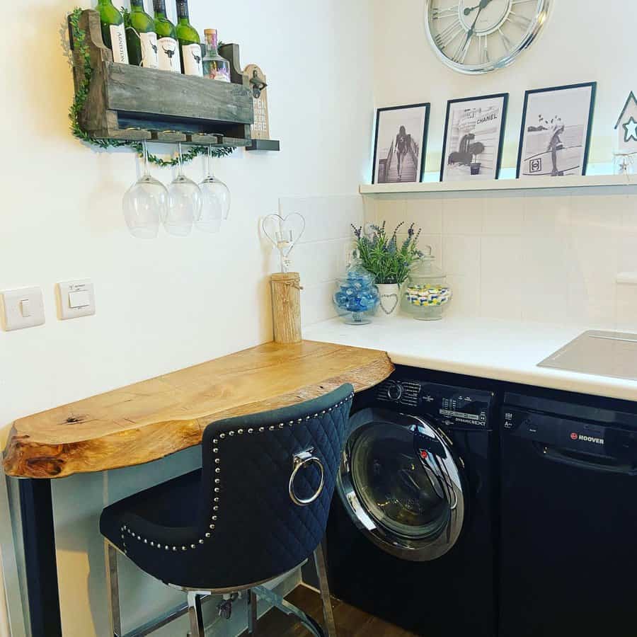 Cozy small breakfast bar with a rustic live-edge wooden countertop, black quilted barstool, wall-mounted wine rack, and stylish decor in a compact space