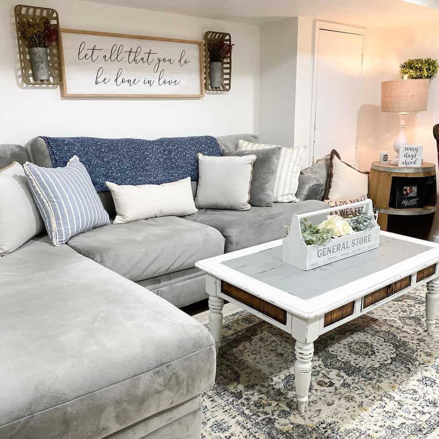 Cozy small basement with a farmhouse-style design, plush sectional, vintage decor, and warm lighting for a charming and inviting space.