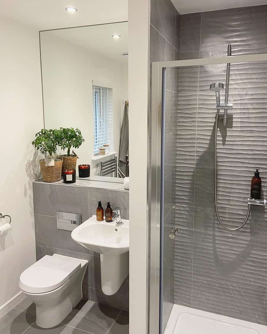 grey bathroom with textured tiles