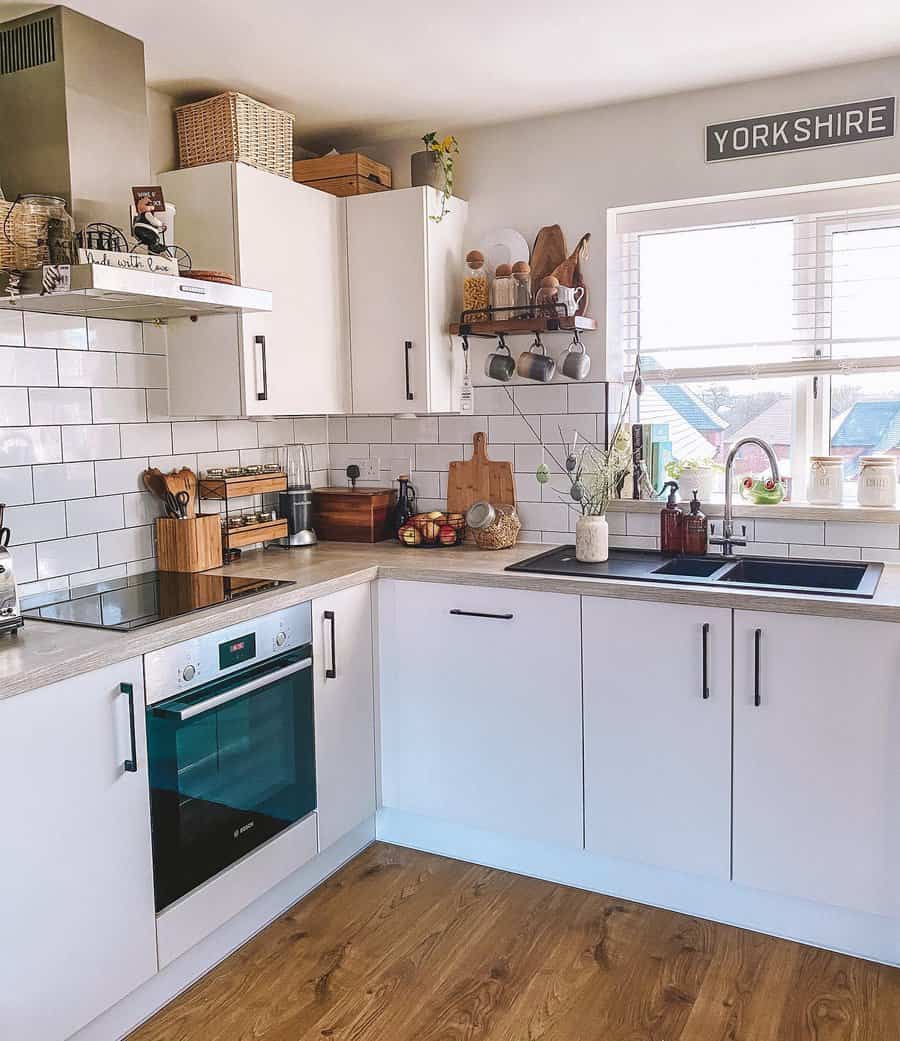 White kitchen with wooden decor