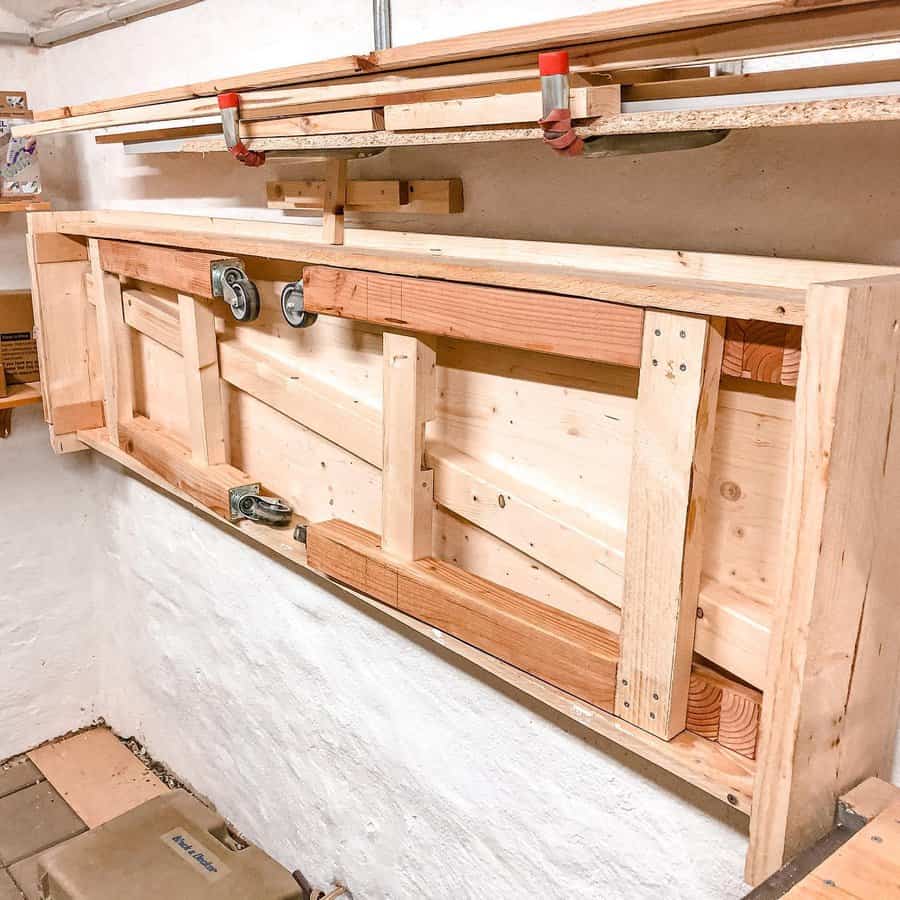 Wooden wall mounted folding workbench with clamps