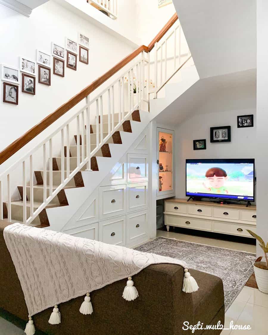 A wooden staircase with storage compartments underneath