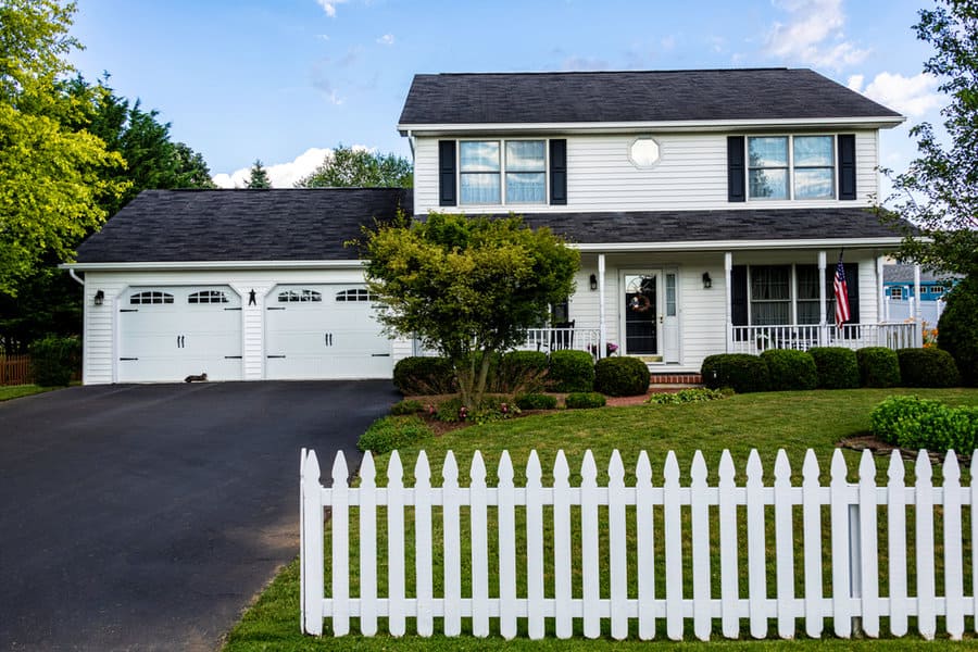 White colonial house with shiplap walls