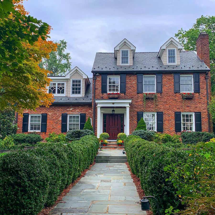 Colonial house with stone paver walk path