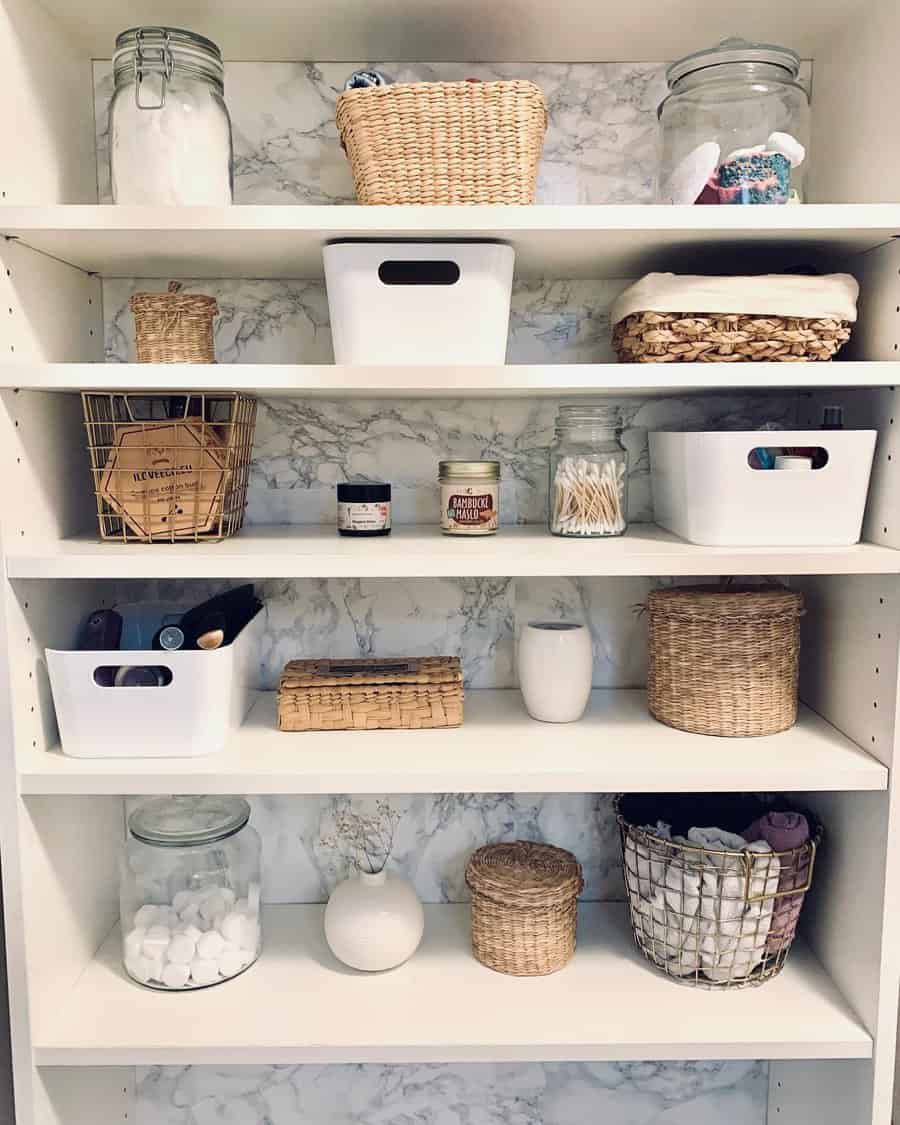 Bathroom closet with jars and wired baskets