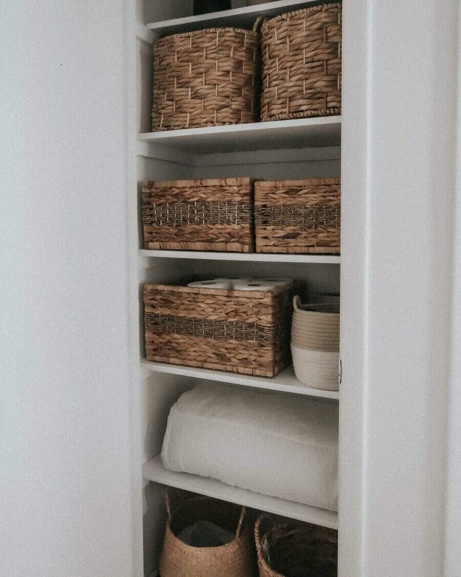 Bathroom closet with wicker organizer