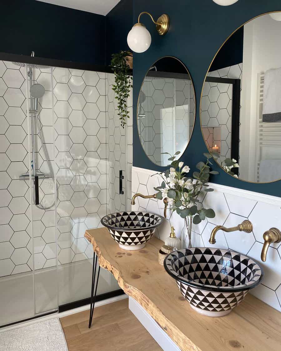 Elegant bathroom with navy walls and geometric tiles