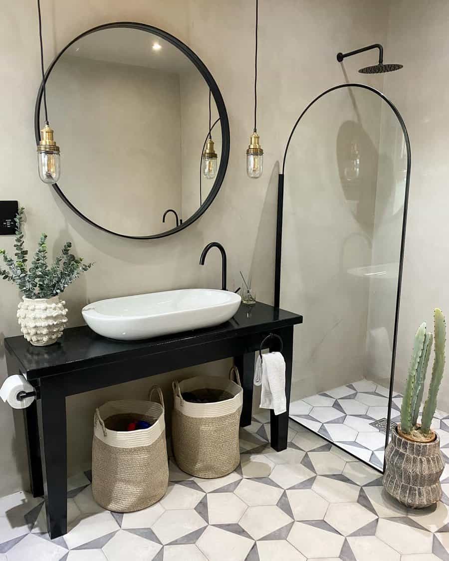 Chic bathroom with round mirror and pendant lights