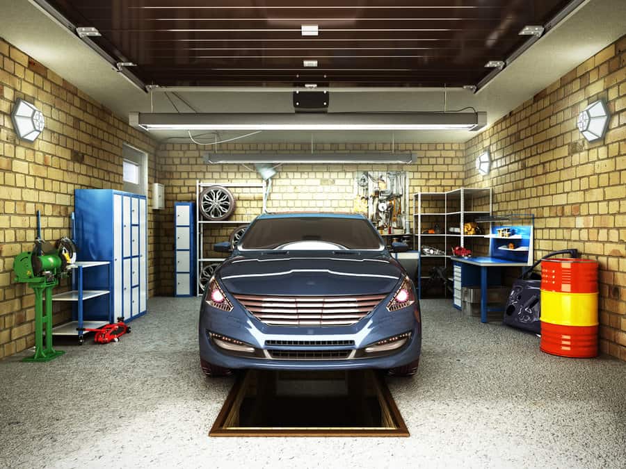 Well equipped garage with car and workstations