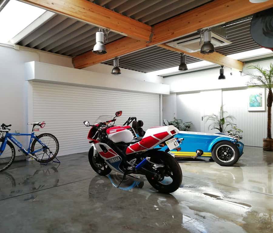 Garage with bikes and suspended lighting