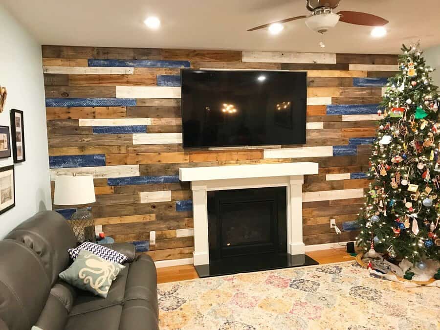 multi-colored wood pallet tv wall