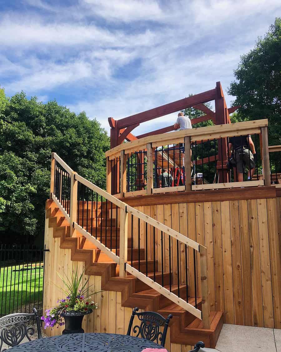 Wooden deck with pergola and zigzag steps