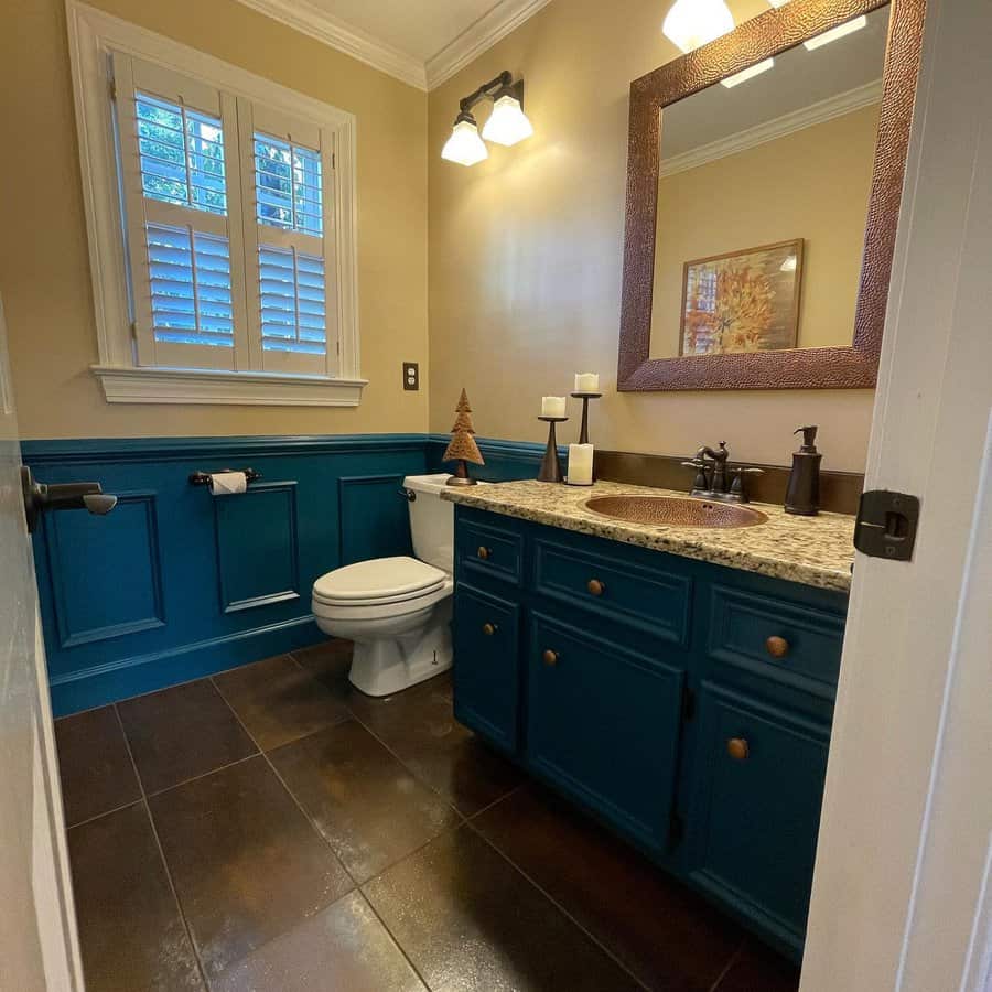 Teal bathroom walls and cabinets