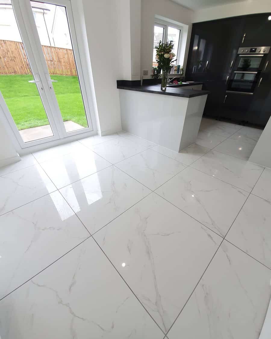 White kitchen with marble flooring