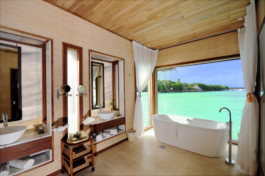 tropical bathroom design with sheer curtains