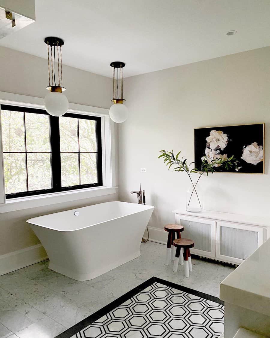 Stylish bathroom with freestanding tub and pendant lights