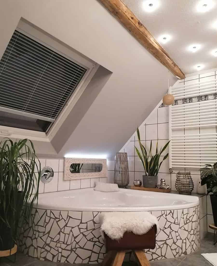Rustic bathroom with mosaic tub surround and skylight