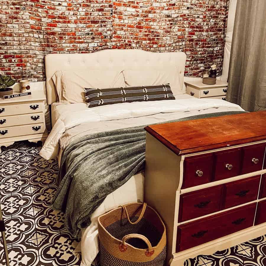 Eclectic bedroom with brick wall print and patterned floor