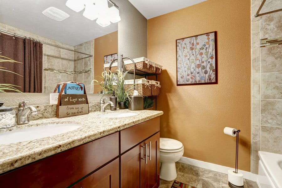 Floral artwork on beige bathroom wall