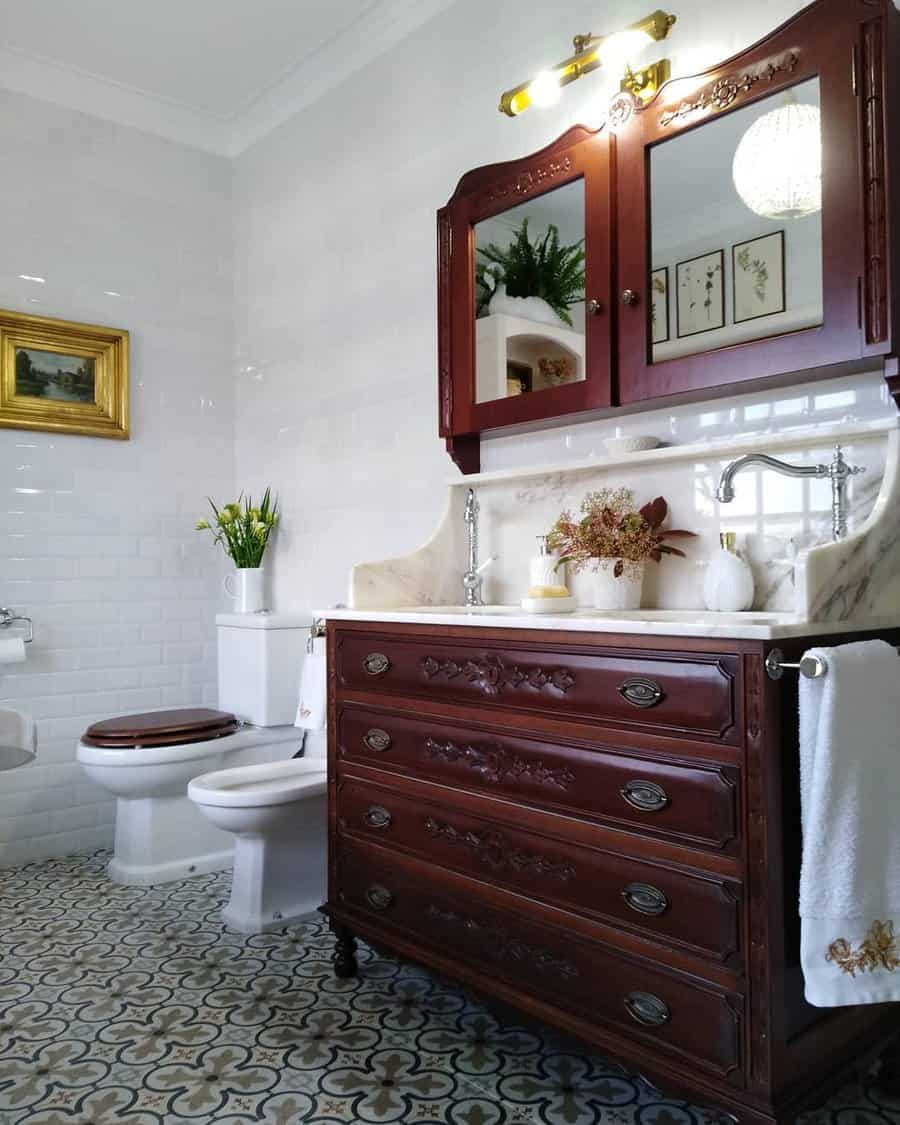 Antique dresser vanity in a bathroom with a vintage style