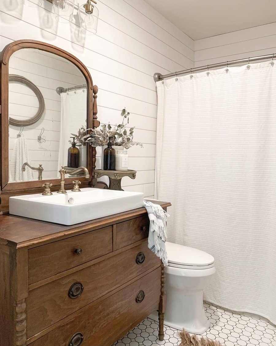 Farmhouse bathroom with classic wooden dresser vanity