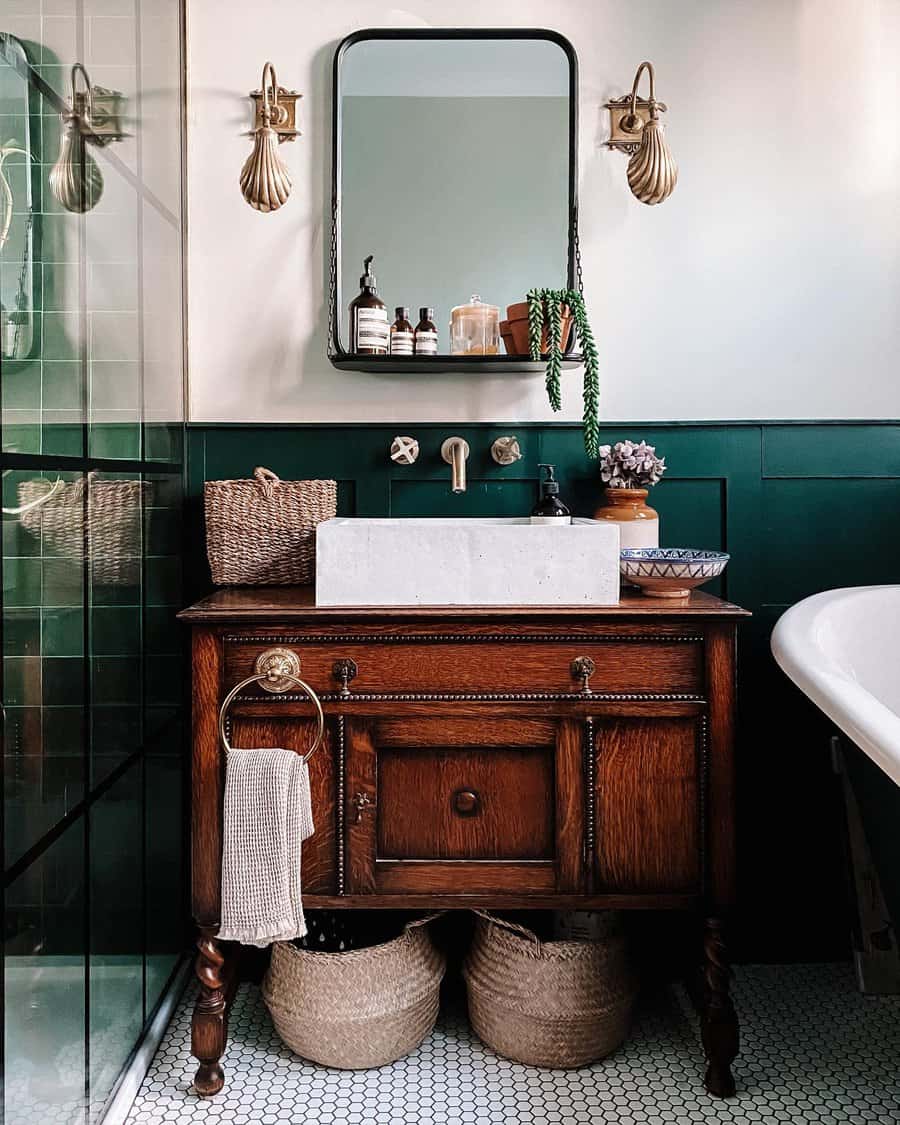 Art Deco bathroom with vintage wood vanity and green tiles