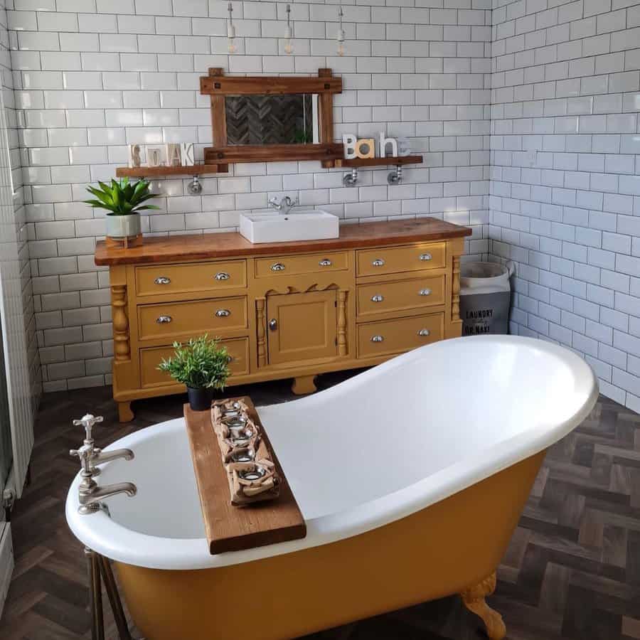 Eclectic bathroom with yellow accents and subway tiles