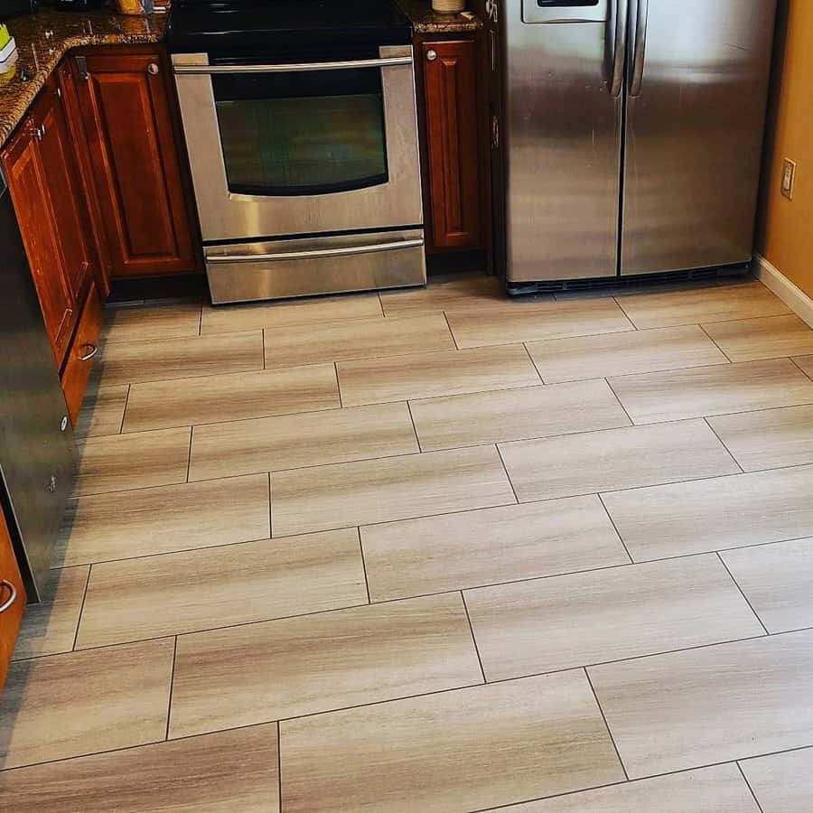 Kitchen with wooden cabinets and light wood look tile floor