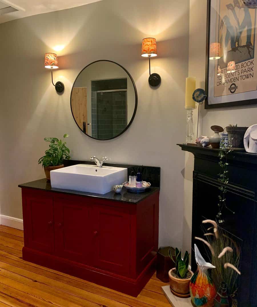 Vanity bathroom with wall-mounted lighting