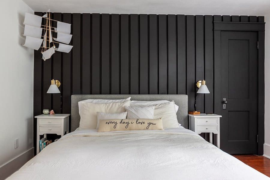 black bedroom with beige pillow and beddings 