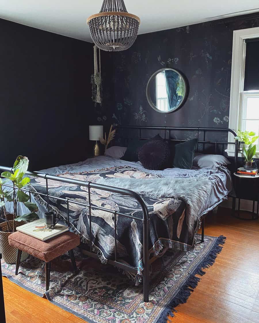 black bedroom with printed wallpaper