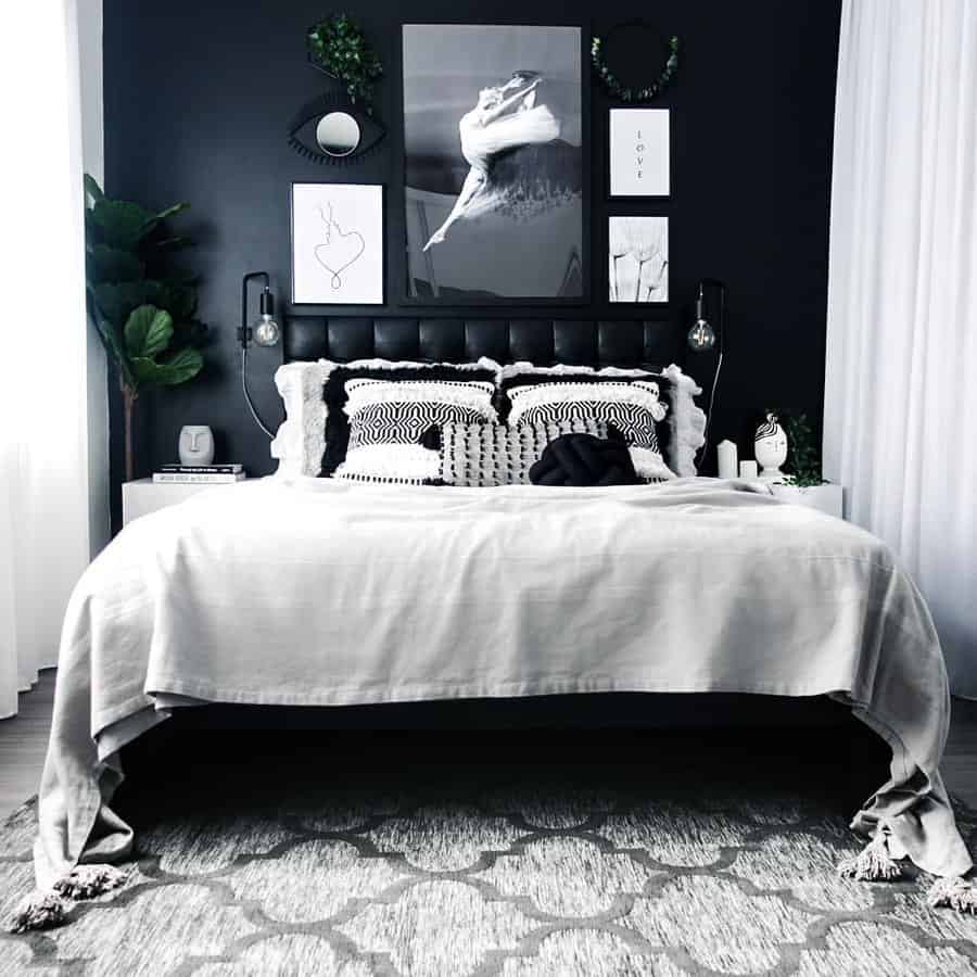 black bedroom with fiddle fig and eucalyptus