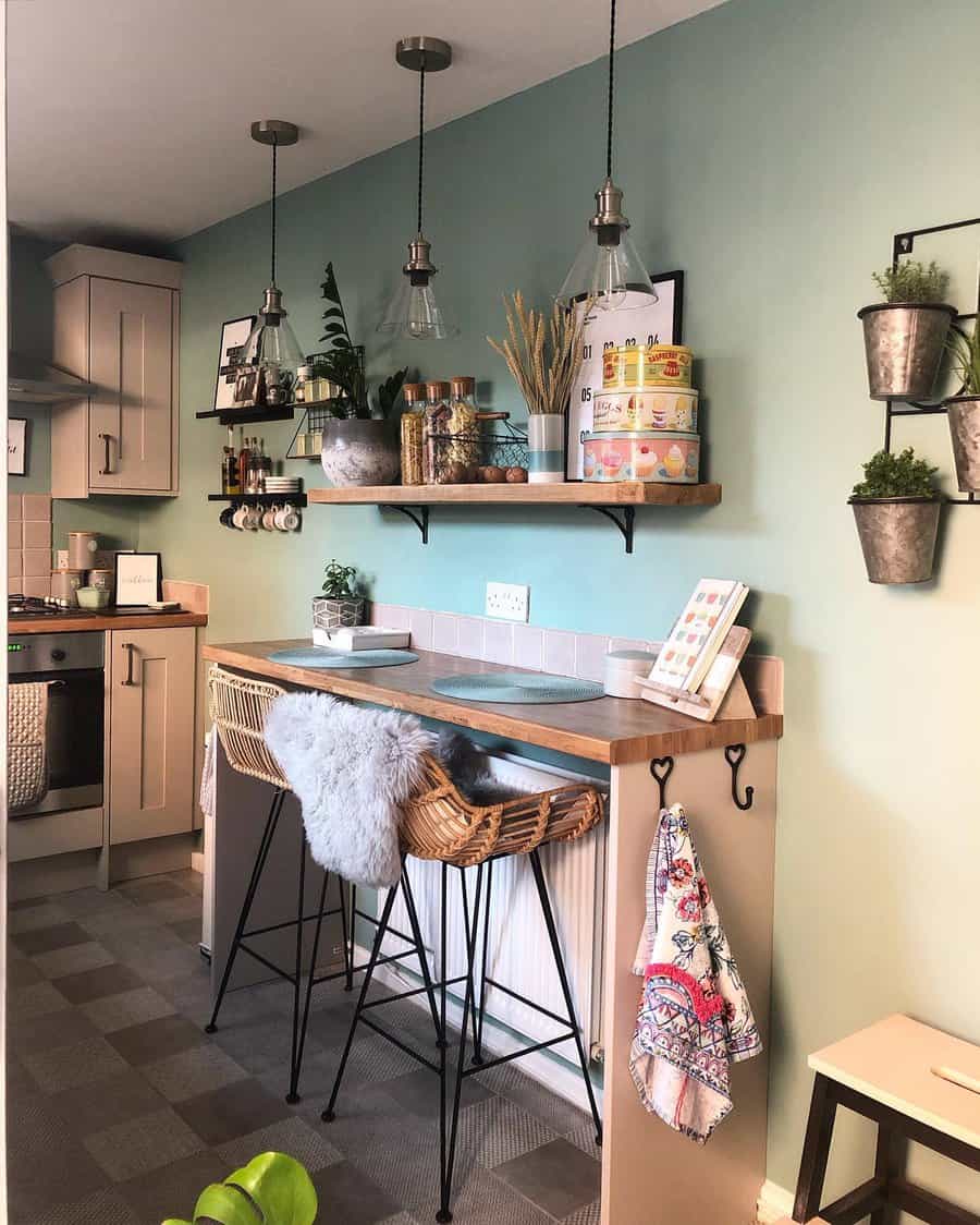 Charming breakfast bar with a wooden countertop, rattan barstools, soft blue walls, pendant lighting, and open shelving for a cozy, rustic touch