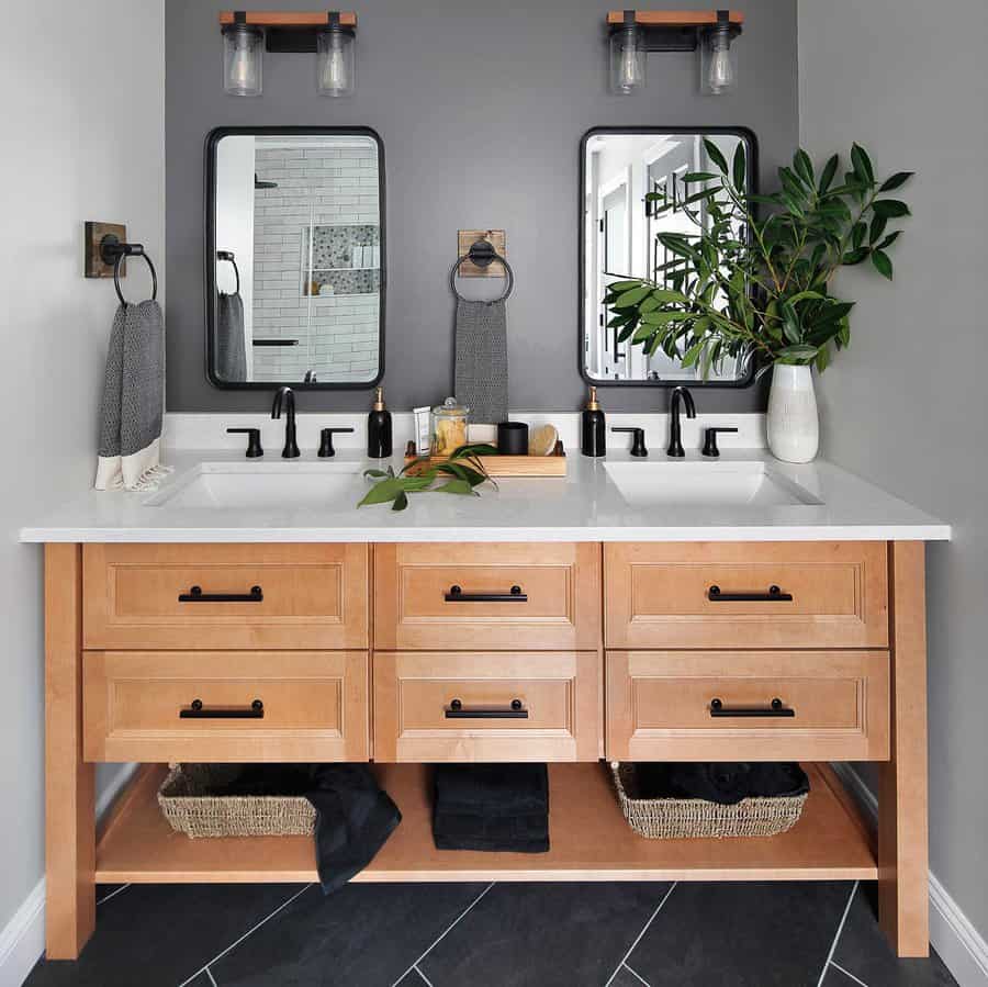 grey bathroom with wood vanity