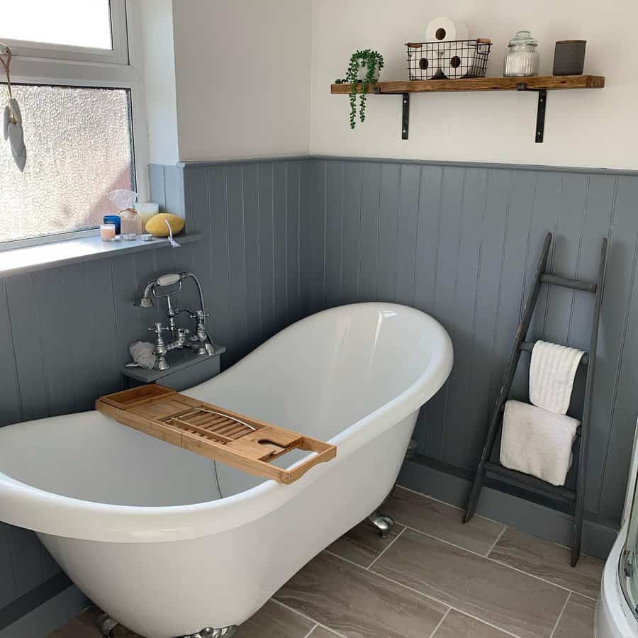 grey bathroom with wood shelf