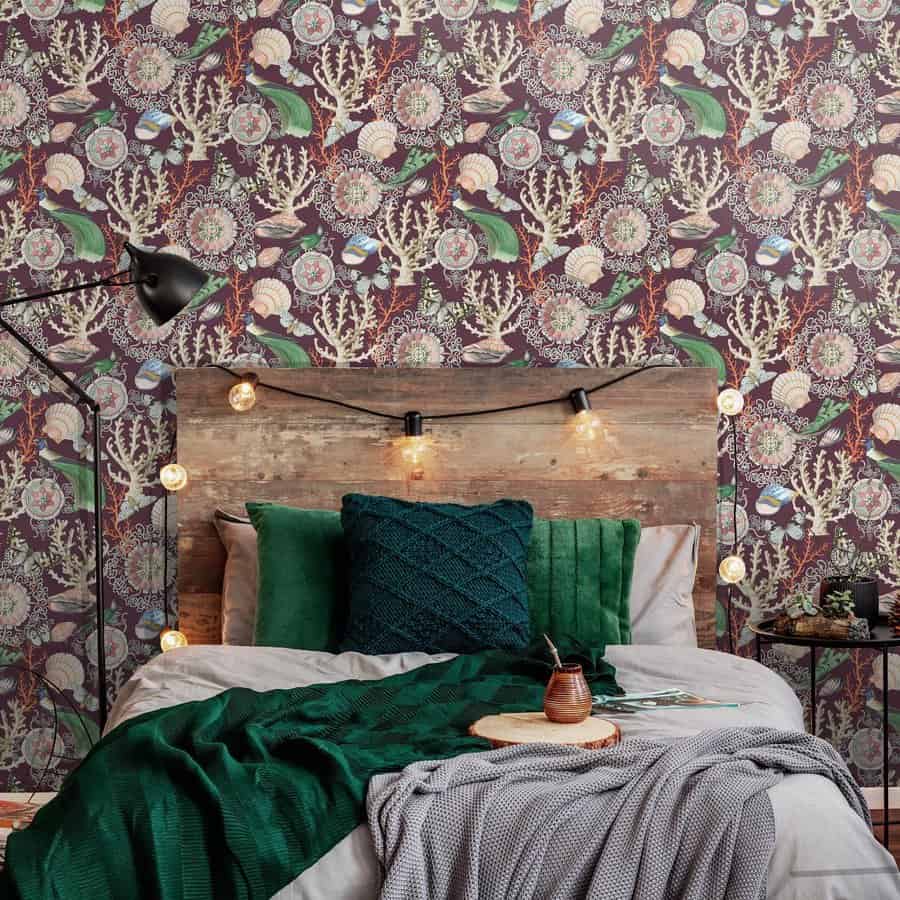 Cozy bed with rustic headboard and botanical wallpaper