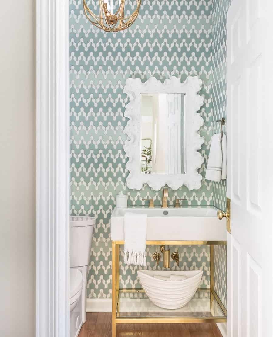 Half bathroom with toilet paper under the washbasin