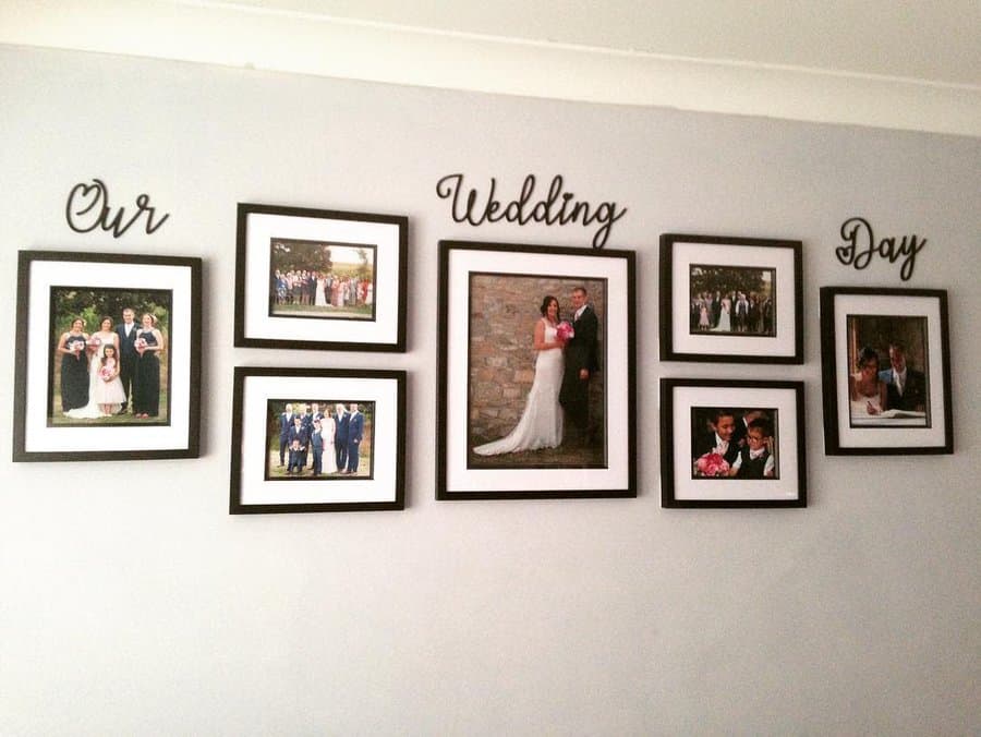 Seven framed wedding photos arranged on a wall with the words "Our Wedding Day" above them