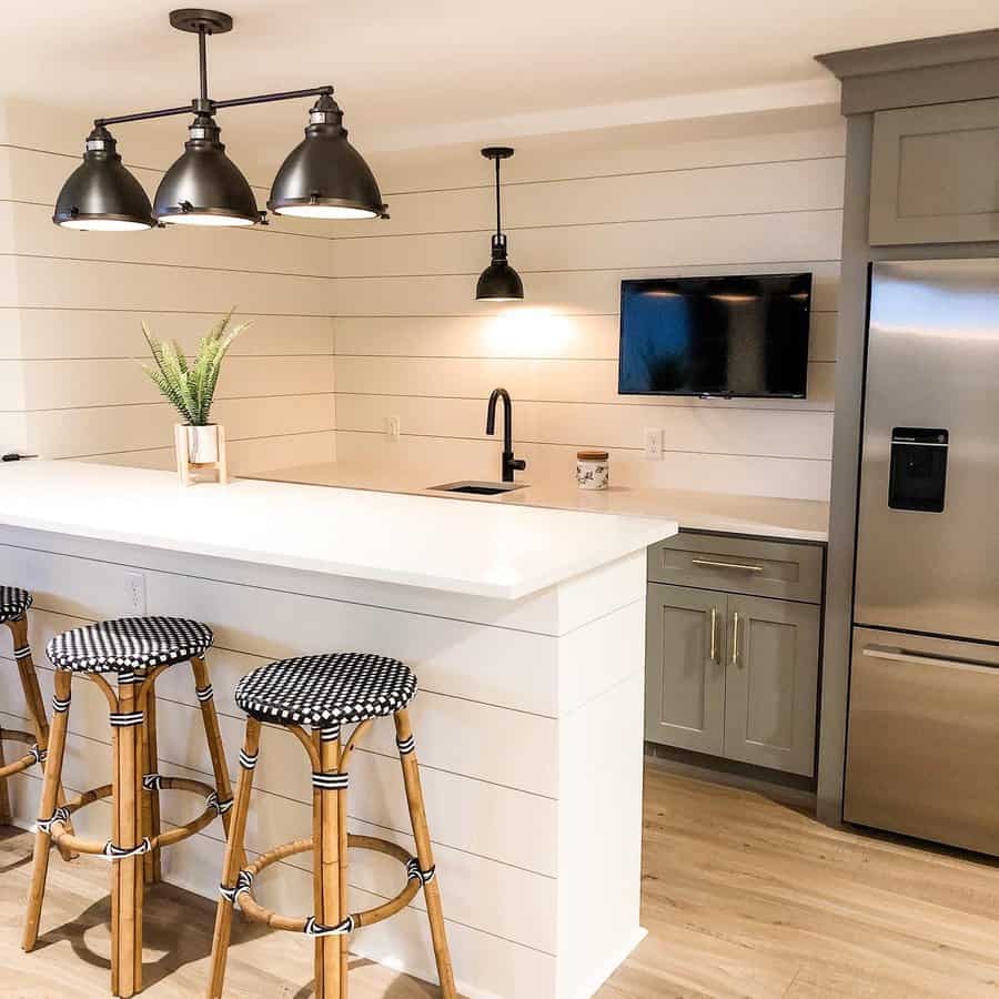 A modern kitchen featuring bar stools