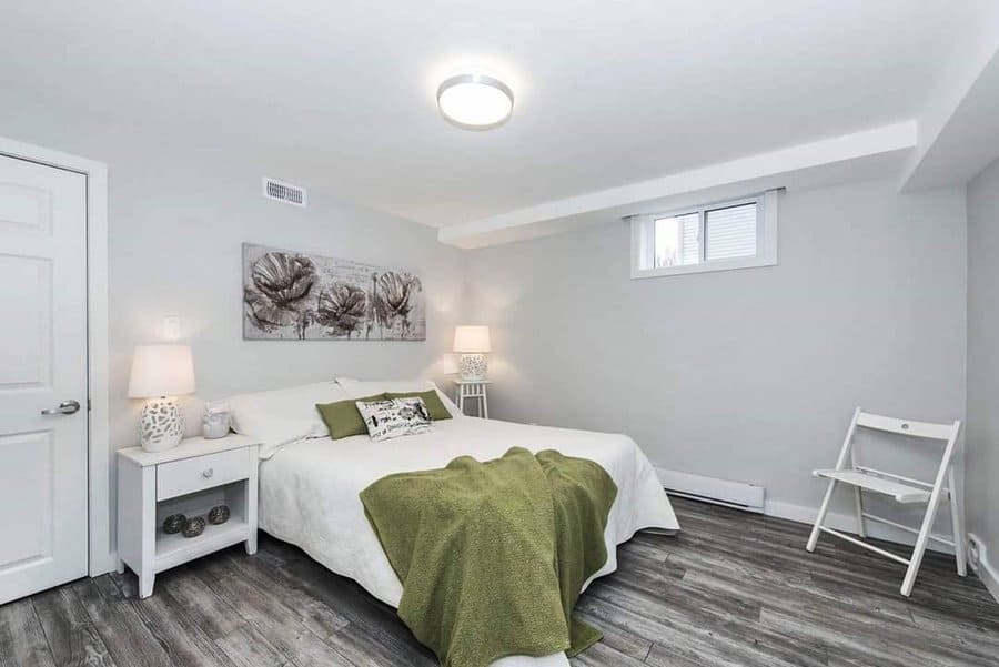 Fresh and airy bedroom with botanical art and green accents