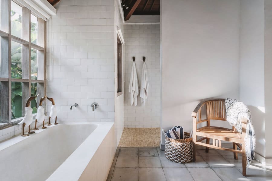white beach bathroom with wood and wicker elements