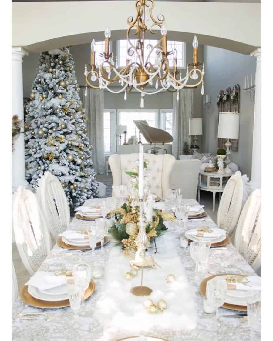 Elegant dining room with a festive table setting and a decorated Christmas tree