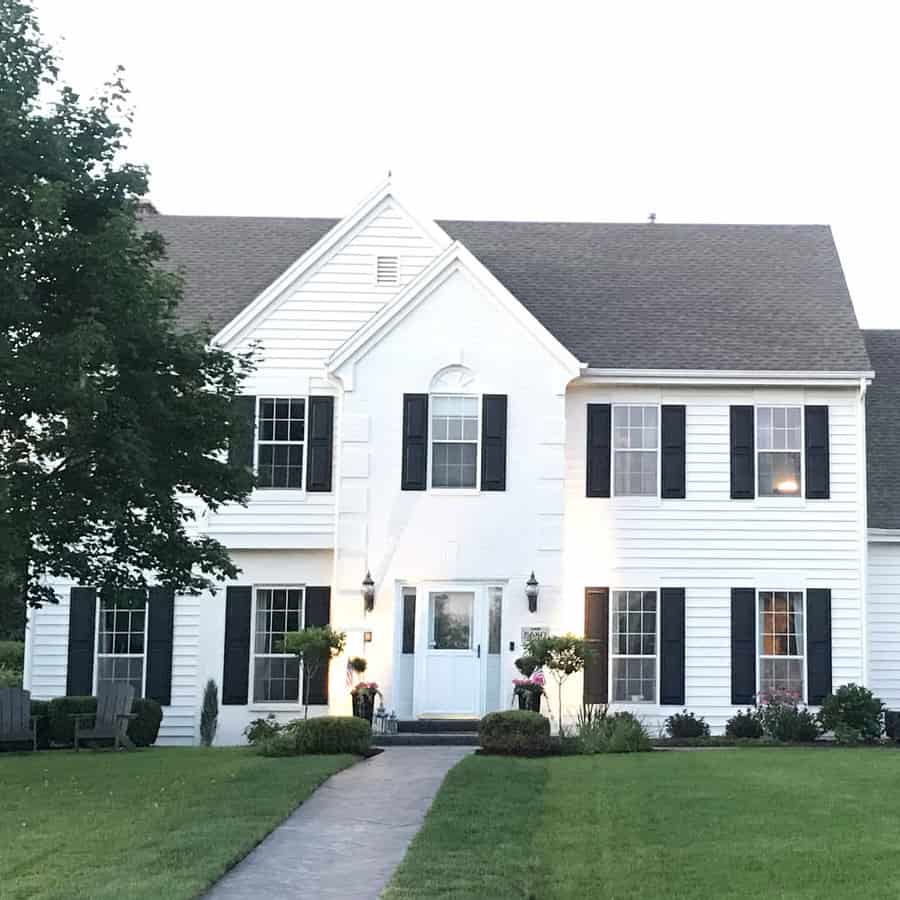 White colonial house with shiplap walls