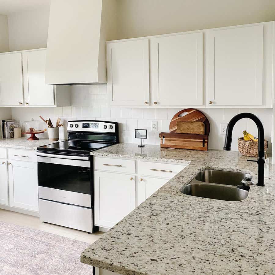 White cabinets with marble countertops