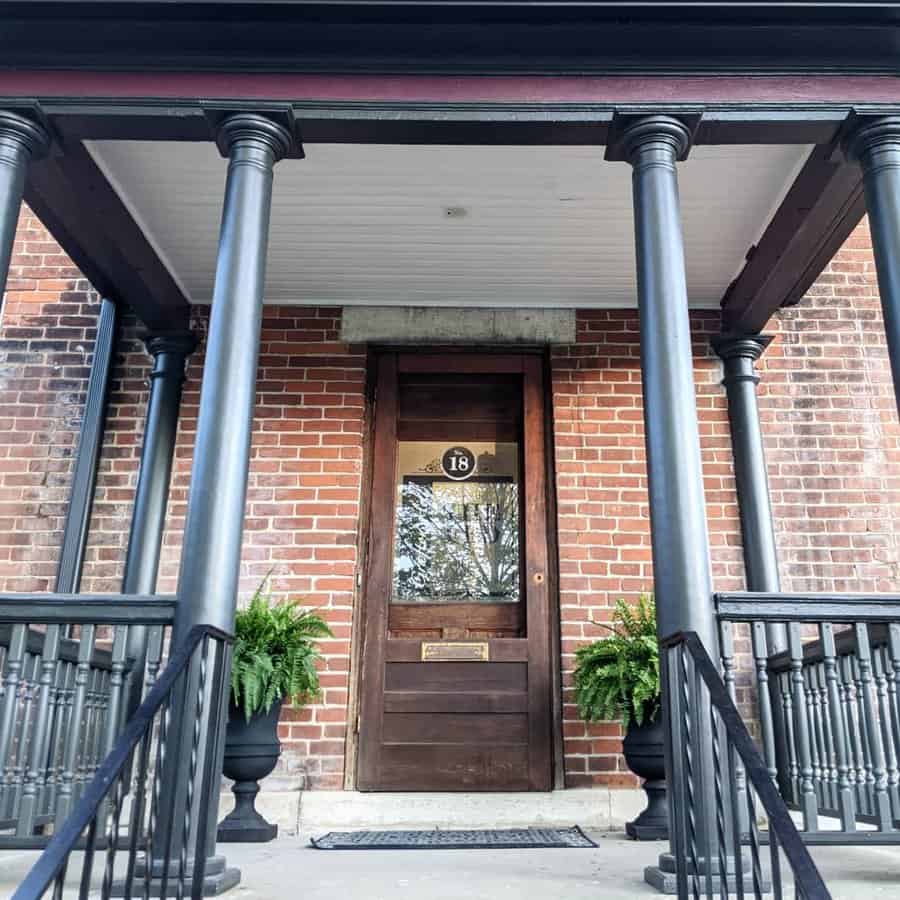 Industrial porch ceiling with black posts