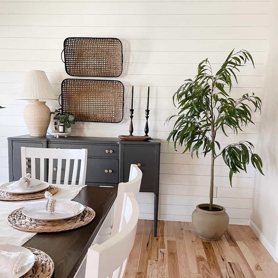 Dining area with white shiplap walls and natural wood accents